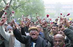 Applicants of the DDA Rohini Residential Scheme-1981 protest outside Vikas Sadan near INA Market in New Delhi on Thursday