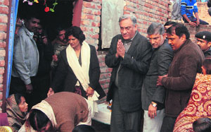 Chief Minister Vijay Bahuguna expresses sympathy with the family of the victim in Haridwar on Thursday. 