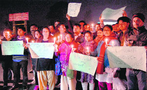 Residents take out a candlelight march in Haridwar on Thursday in protest against the rape and murder of a young girl.