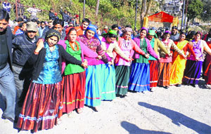 Women from Jaunpur-Jaunsar-Rawain community dance in traditional attire during the Maroj festival in Mussoorie on Thursday.