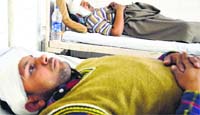 The victims, Sonu and Harpreet Singh, under treatment in Ludhiana on Thursday. Photo: Inderjeet Verma