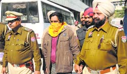 The accused, Inderjit Singh, being taken to a court in Ludhiana on Thursday. Tribune photo: Himanshu Mahajan