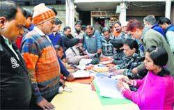 A team of the Health Department registers small eateries at a camp at Bhadaur House in Ludhiana. Photo: Inderjeet Verma