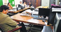 Employees sit idle in an office during the strike by the DC Office Employees Union. Photo: Inderjeet Verma