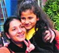 Manya, who got selected through the draw of lots, in a jubilant mood with her mother at Strawberry Fields School, Sector 26, in Chandigarh on Friday. Tribune Photo: Parvesh Chauhan