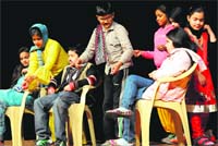 Children stage a play on child labour at Tagore Theatre in Chandigarh on Friday. Tribune photo: Vicky Gharu