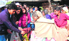 Students distribute woollen garments among the poor under the aegis of social forum Tulip Welfare in Haridwar on Friday.