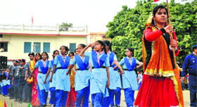 Girl guides from Almora participate in the state-level rally of Scouts and Guides in Dehradun on Friday.