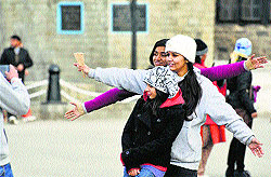 Tourists enjoy a cool weather in Shimla on Friday