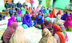 Women gather for the monthly meeting of a self-help group at Kawa village in Udhampur district. A Tribune Photo