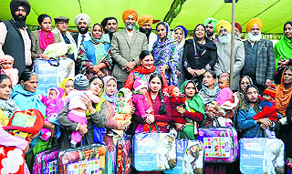 Mothers with their baby girls at a function in Ludhiana on Friday