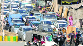 Traffic jam on Bhandari Bridge that caused inconvenience to commuters in Amritsar on Saturday.