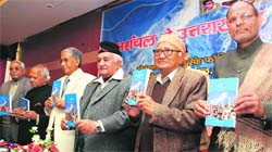 Dignataries at the release of a book written by former BJP minister Kedar Singh Fonia (second from right) at a function in Dehradun on Saturday. A Tribune photograph