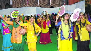 Students of a Ludhiana school perform giddha during the NRI Sammelan in Jalandhar on Saturday. 