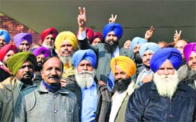 Supporters of Harbans Singh Mundi (centre, in blue turban) in a jubilant mood after the union poll results were declared at the PAU in Ludhiana on Saturday