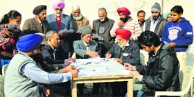 Residents enrol with the Aam Aadmi Party during a membership drive at the community centre in BRS Nagar, Ludhiana, on Saturday