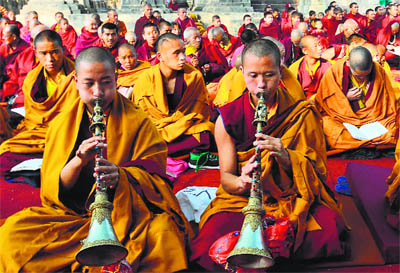 Bhutanese Buddhist monks play traditional instruments during the Jonag Monlam prayer offering at the Mahabodhi Temple in Bodhgaya in northern Bihar.