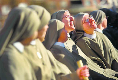 Nuns attend the mass for the Holy Family in Madrid. Tens of thousands of believers poured into central Madrid to celebrate an open-air Roman Catholic mass for the Holy Family recently, just days after the Spanish government agreed to tighten the abortion law.