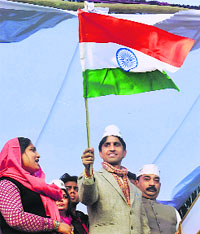 Aam Aadmi Party leader Kumar Vishwas waves the Tricolour during a rally in Amethi on Sunday.