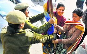 Candidates for the posts of jail warden scuffle with the police during a protest in Jammu on Sunday.