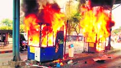Toll booths set on fire during an anti-toll agitation in Kolhapur, Maharashtra, on Sunday. PTI