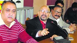 Congress leaders from Doaba address the media in Jalandhar on Sunday. tribune Photo
