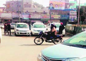 Vehicles parked between roundabout and divider in front of Shivpuri (cremation ground) at Hathi Gate in Amritsar