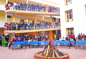 Students of the Indo Global Group of Colleges, Mohali, celebrate Lohri on Monday.