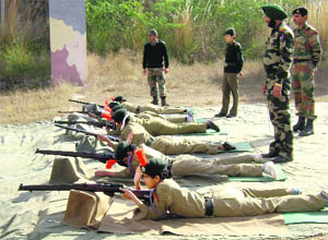Cadets from the No. 1 Chandigarh Girls NCC Battalion practise firing during their annual winter training camp at Chandimandir.