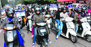 Women take part in a campaign organised by the Traffic Police in Chandigarh on Monday.