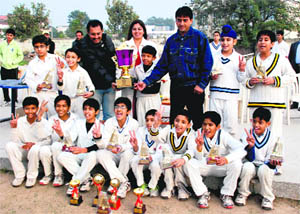 Team of the Hansraj Cricket Academy with the trophy after winning a tournament at Sector 6, Panchkula, on Monday. 