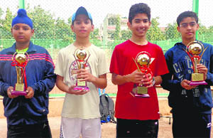 Winners of a tennis tournament with their trophies at Manav Mangal School, Sector 11, Panchkula.