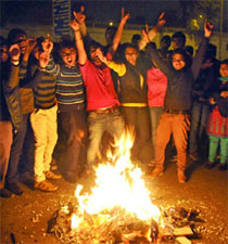 People celebrate Lohri on Mata Sundri Road in New Delhi on Monday