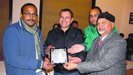 District Magistrate BVRC Purushotam (left) being felicitated in Mussoorie on Sunday, for his role in making the recently organised Winter Line Carnival a grand success.