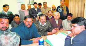 Dharamshala committee members demand a waiver of sewage tax from the Jal Sansthan officials in Haridwar on Monday.