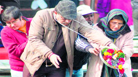 Former Police officer Kiran Bedi immerses the ashes of her father in the Ganga in Haridwar on Monday.