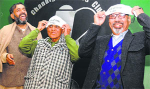 AAP leader Yogendra Yadav (left) inducts former HPSC chairman DR Chaudhary (centre) and former DGP (Prisons), Punjab, Shashi Kant into the party in Chandigarh on Monday