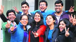 Successful students flash the victory sign in Chandigarh on Tuesday. Tribune photo: Manoj Mahajan