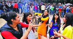 Students of Panjab University celebrate Lohri at the Students Centre on Tuesday. Tribune photo: Pradeep Tewari