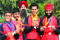 Special children show their medals won during the National Roller Skating Championship held in Bareli, UP. Tribune photo: Manoj Mahajan