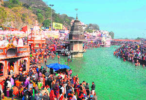 Devotees take a holy dip in the Ganga in Haridwar on Tuesday. 