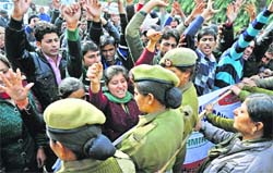 Volunteers of the All Jammu and Kashmir National Youth Corps scuffle with the police during a protest in Jammu on Tuesday. Tribune photo: Inderjeet Singh