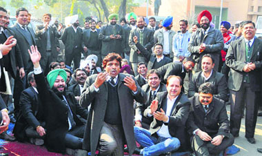 Lawyers hold protest outside the DC office in Ludhiana on Tuesday.