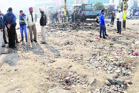 The enforcement wing of the MC clears encroachments on the route for the proposed city bus service in Amritsar on Wednesday