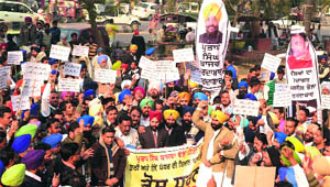 Members of the Youth Akali Dal (YAD) stage a protest in Bathinda on Wednesday to protest against the naming of Cabinet Minister Bikram Singh Majithia by druglord Bhola in a case of drug trafficking.