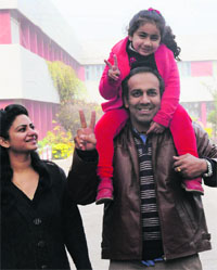 Letisha and her parents in a jubilant mood after she was declared successful in the draw of lots for admission to Sacred Heart School, Sector 26, Chandigarh, on Wednesday.