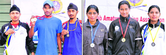 Winners of the Punjab State Rowing Championship for Men and Women with their medals at the Sukhna Lake, Chandigarh, on Wednesday.