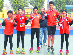 Winners of the 59th School Nationals with their medals at Blue Bird School, Panchkula, on Wednesday