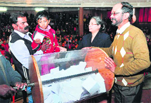 A child picks up a slip during the draw of lots at St Annes School in Sector 32, Chandigarh, on Wednesday.