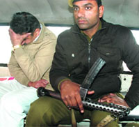 Accused Ram Kumar Chaudhary being taken to a court in a police van in Panchkula on Wednesday.